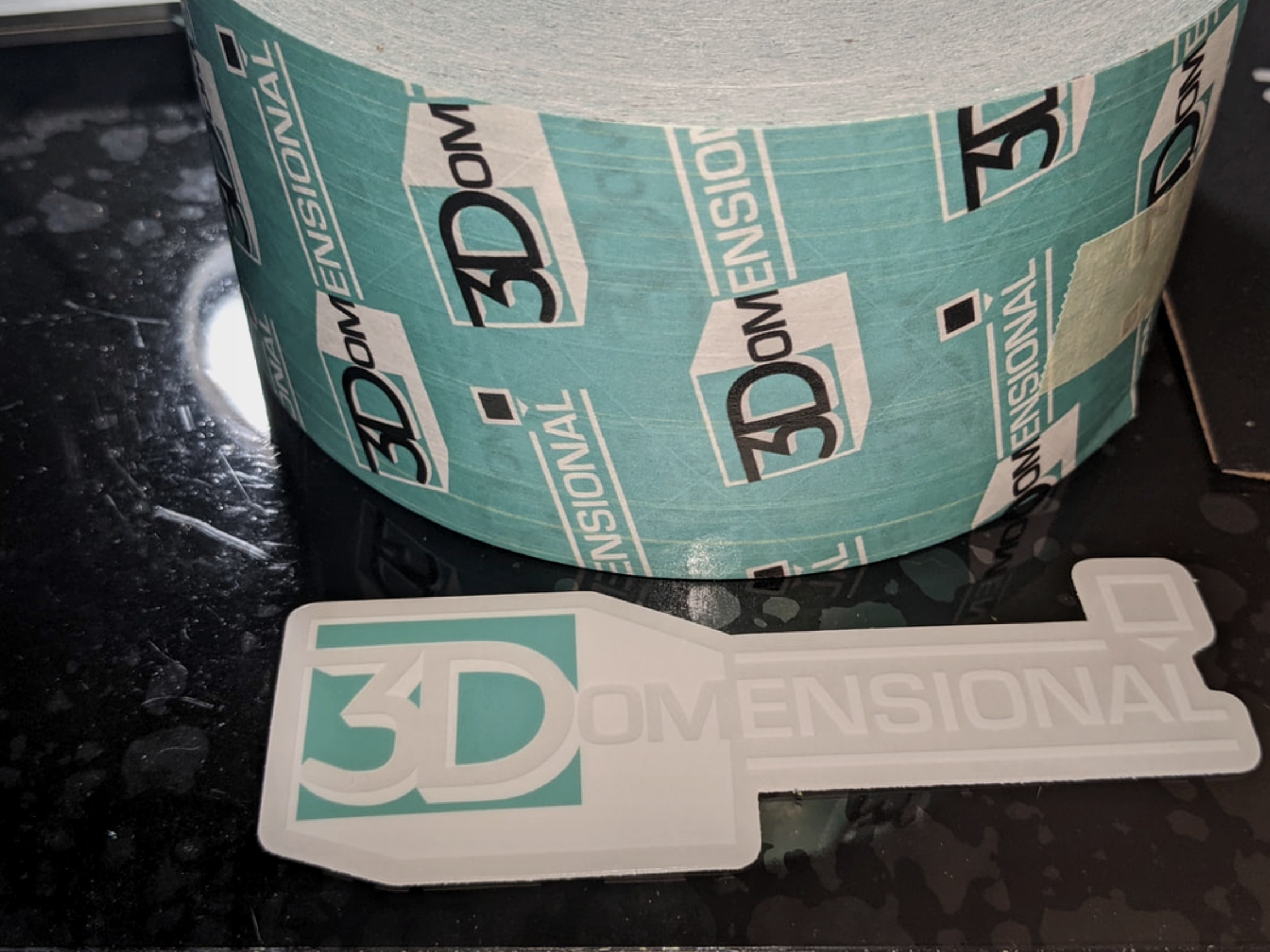 3Domensional branded tape roll and die-cut logo sticker printed on Prusa
